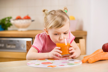 little girl with carrot juice © mbt_studio