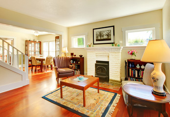 Beautiful sunny living room with fireplace and cherry floor.