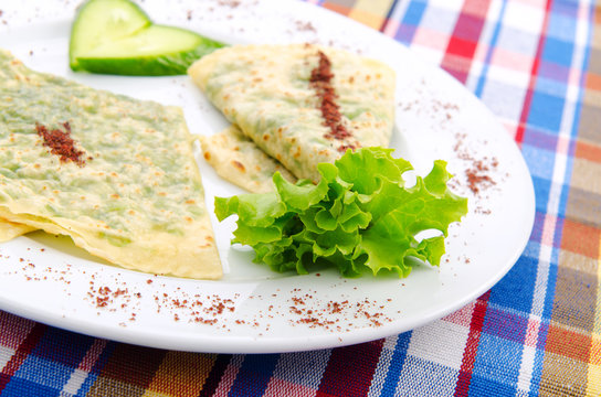 Herb stuffed pancaces in the plate