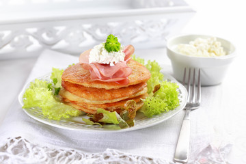 Small potato pancakes with salad