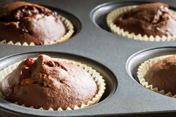 Closeup chocolate muffin in baking tray