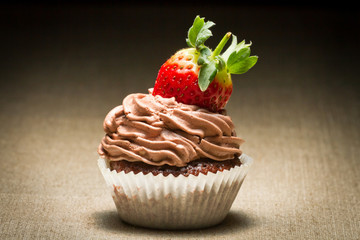 Chocolate muffin with strawberry and nut cream
