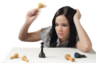 Thinking girl with chess