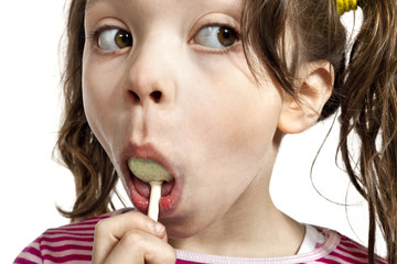 Girl with a lollipop, isolated on white background