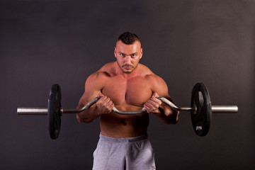 Fototapeta na wymiar Man lifting weights