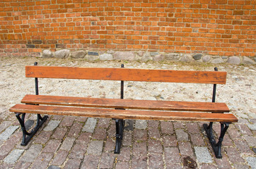 wooden bench in the street