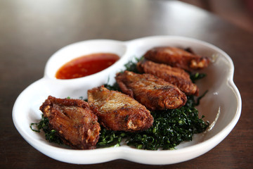 Fried chicken on wood background