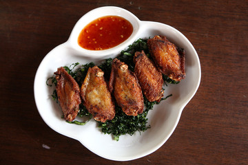 Fried chicken on wood background