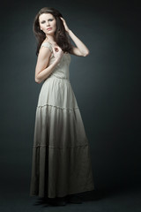 Fototapeta premium Fashion female model with long curly hair.