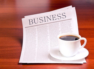 Newspaper and cup of coffee