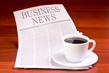 Newspaper and cup of coffee