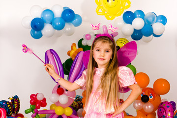 Fototapeta na wymiar Beautiful little girl in balloon forest