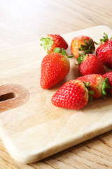 Strawberries on a chopping board