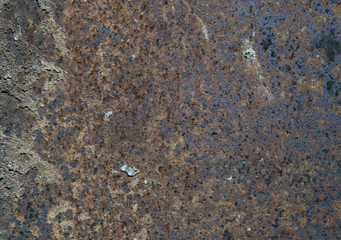 Industrial piece of rusty metal and screws