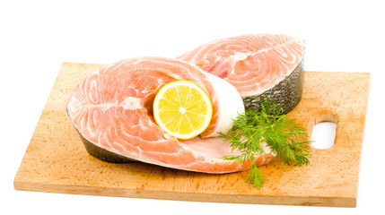 Piece of a salmon with lemon and dill