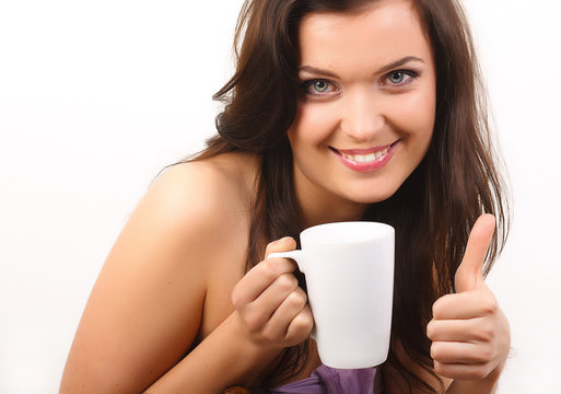 young beautiful woman with a white cup of tea or coffee