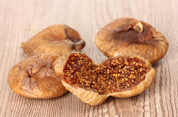 delicious dried figs on wooden background
