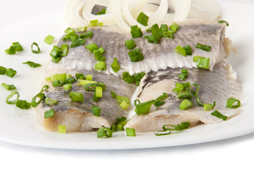 Fillet herring on the plate and on white Background