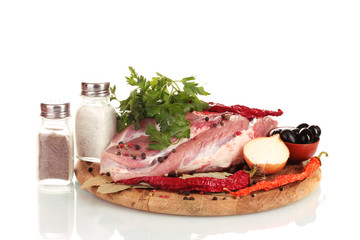 Raw meat and vegetables on a wooden board isolated on whitе