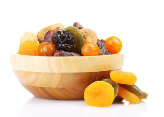 Dried fruits in wooden bowl isolated on white