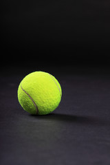 tennis balls on black background studio shot