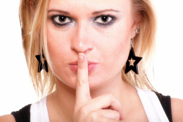 Naklejka premium Young girl asking for silence finger