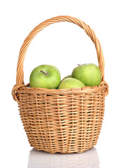 basket of green apples on white background