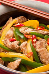 Fried Chicken with capsicum on red table cloth