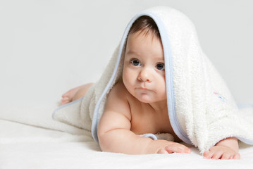 Little baby under white towel