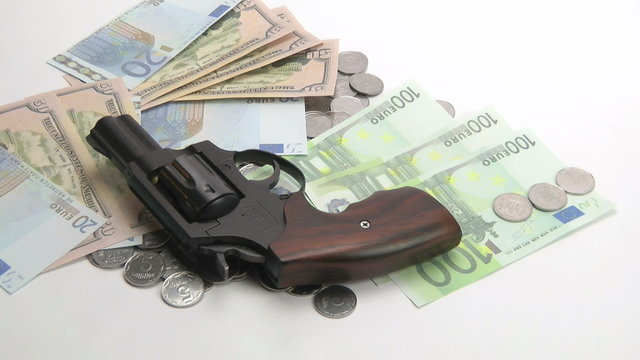 The gun lay on the money