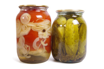 Pickled cucumber and tomato in glass