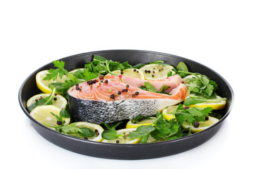 Red fish with lemon, parsley and pepper
