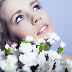 Beautiful and sexy face of woman with flowers