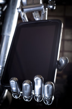 Robot hand holding tablet pc