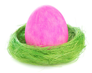 Easter egg in the nest isolated on white background