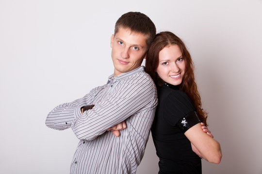 young couple with folded hands