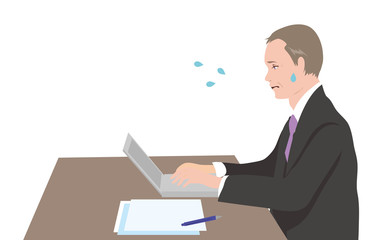 デスクに向かうミドルのビジネスマン