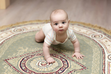 Baby crawling on carpet