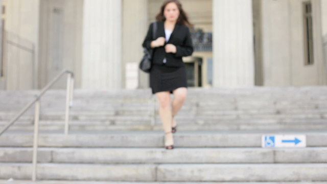 Businesswoman approaching from staircase