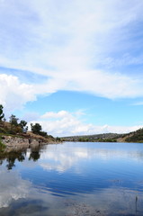 lake under cloudy blue sky