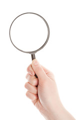 Hand holding magnifying glass