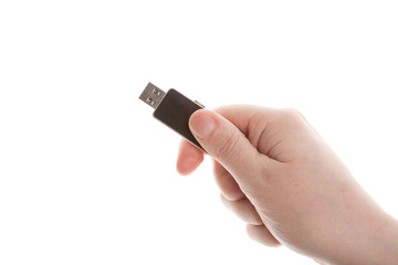 Hand holding black USB key