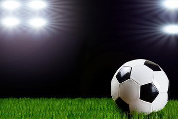 Fototapeta na wymiar Soccer ball in the stadium lights