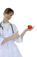 The nurse with an apple in a hand