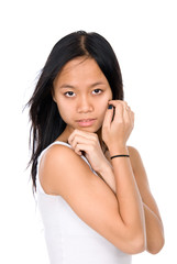 The beautiful Vietnamese girl with hands at a cheek