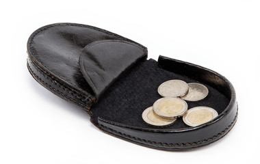 Black purse with metal coins on white background.