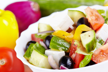 Greek salad and ingredients to it