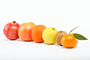 pomegranates and citrus fruits isolated on a white background.