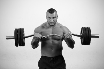 Fototapeta premium Man lifting weights