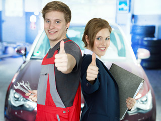 Apprentices for car mechanic and the office show thumbs up